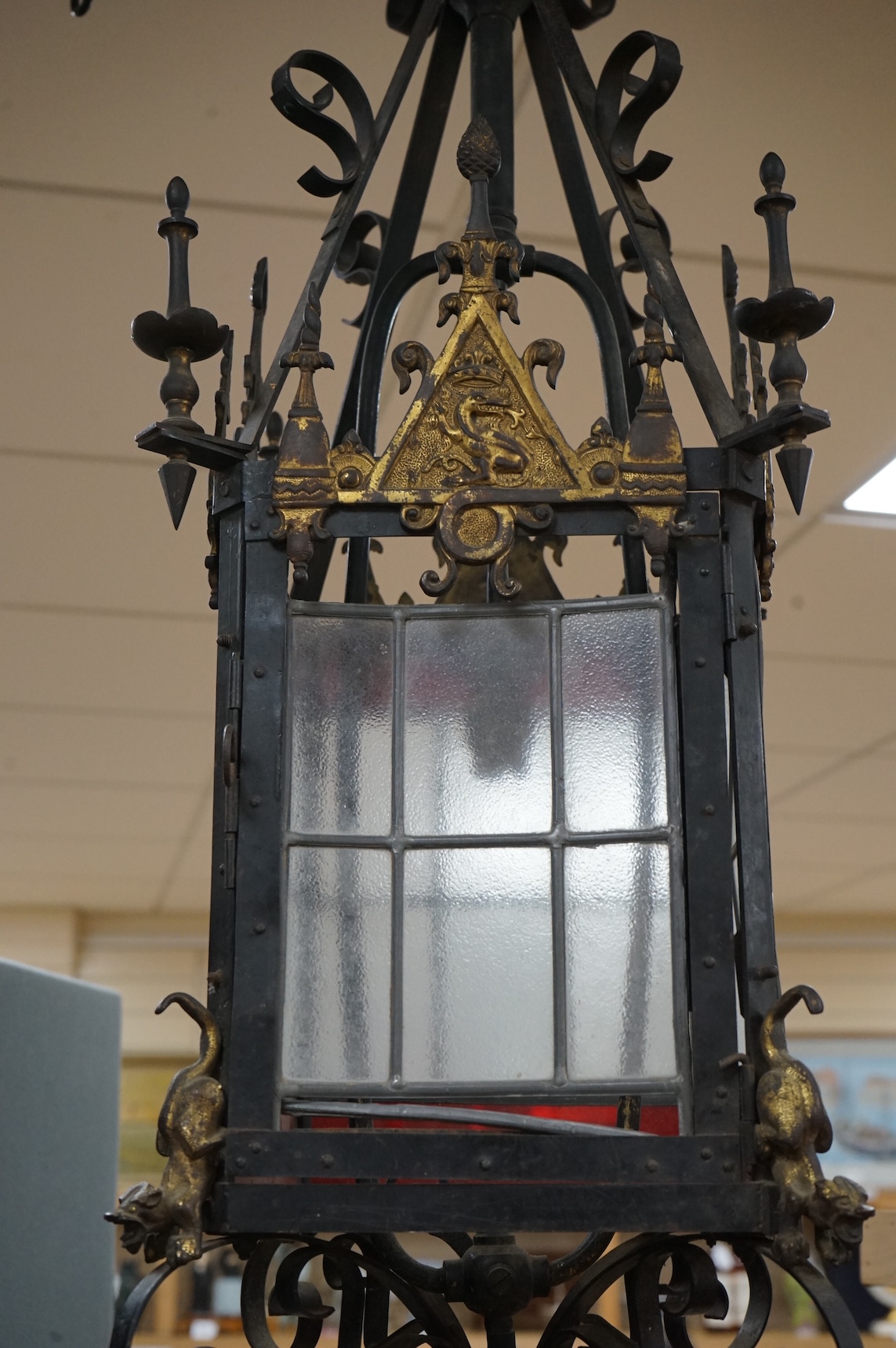 A large wrought iron and gilt bronze hall lantern, 94cm high